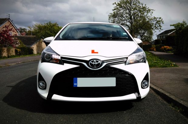 White Toyota Carolla displaying 'L' plates