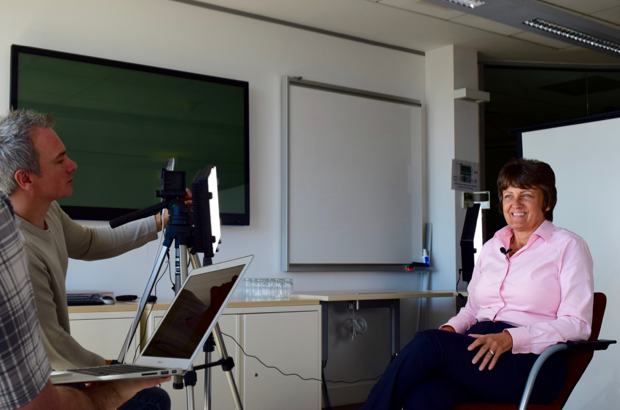 Lesley Young sat in a chair facing cameraman during filming session