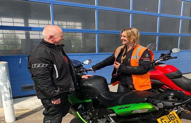 Laura Smith and Frank Finch chat alongside their bikes