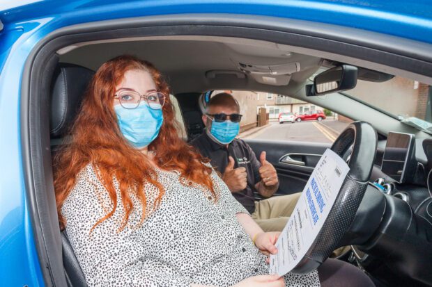 Pupil with their driving instructor