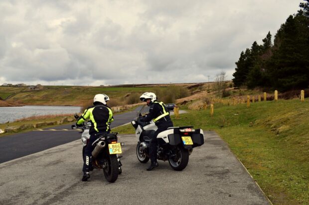 Two motorcyclists in layby