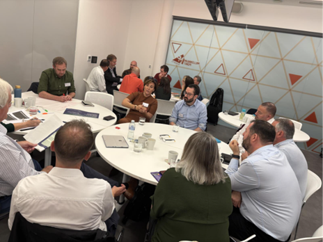 DVSA and driver training industry representatives in discussion at the car driver training and testing forum meeting in September 2025