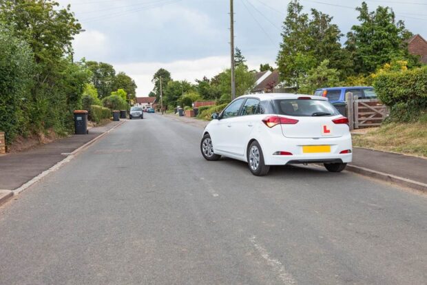 White car moving from side of the road